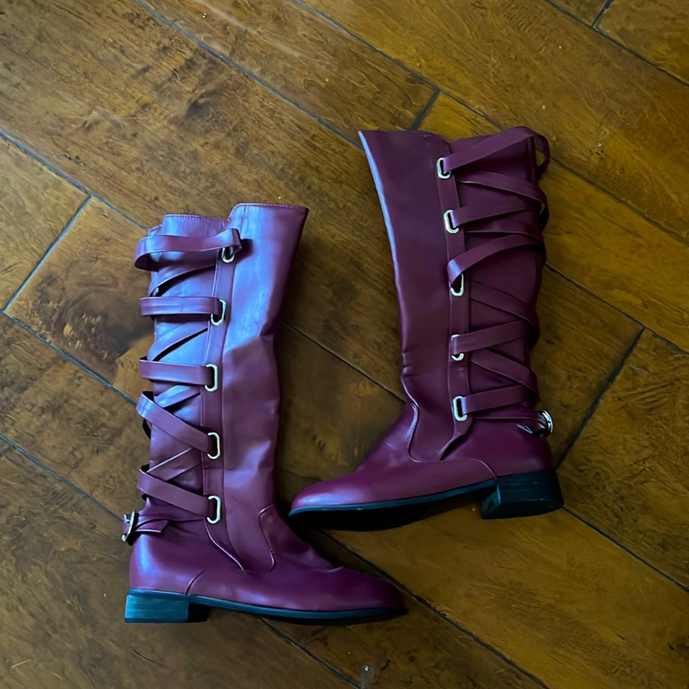 Size 8 women’s maroon riding boots. Never worn. Purchased in NYC — and no tags.
